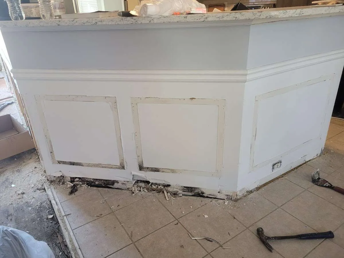 Water damage and mold on kitchen during Sewage Cleanup & Sanitation in Indiantown